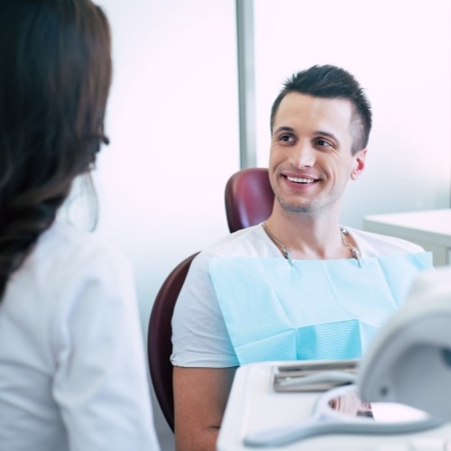 Dental patient talking to dentist