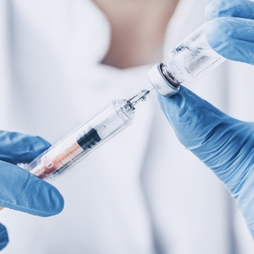 Dentist placing Botox in syringe