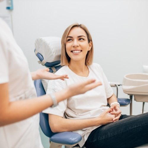 Smiling woman enjoying the benefits of CEREC dental crowns