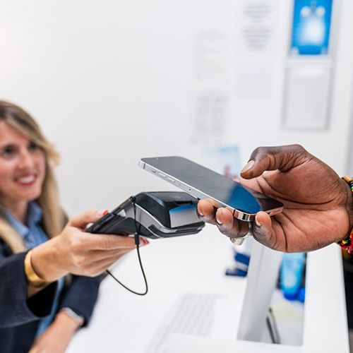 Patient making payment on phone