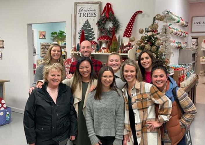 The Healthy Smiles Columbia team in front of Christmas tree