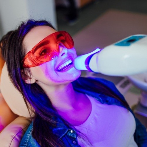 Dental patient receiving teeth whitening