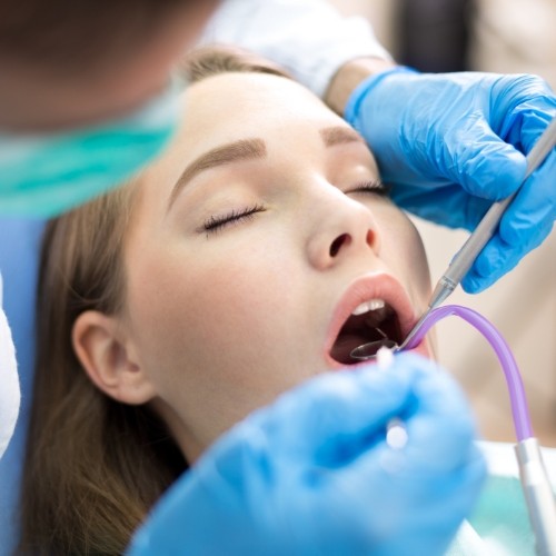 Dentistry patient receiving in depth dental evaluation
