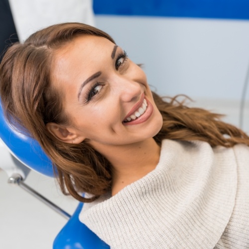 Dentistry patient smiling after refreshing dental hygiene appointment