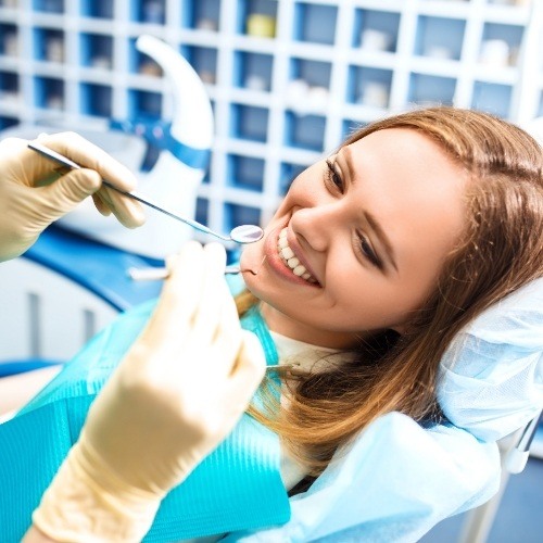 Woman receiving dental exam