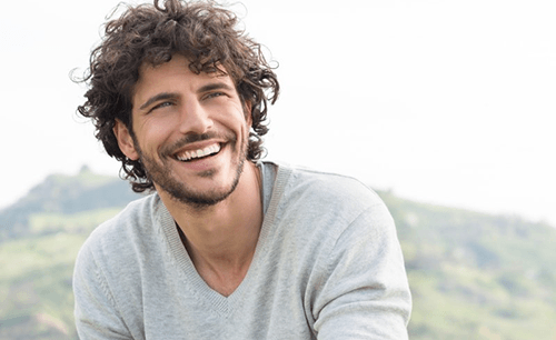 a man smiling with dental implants in Columbia