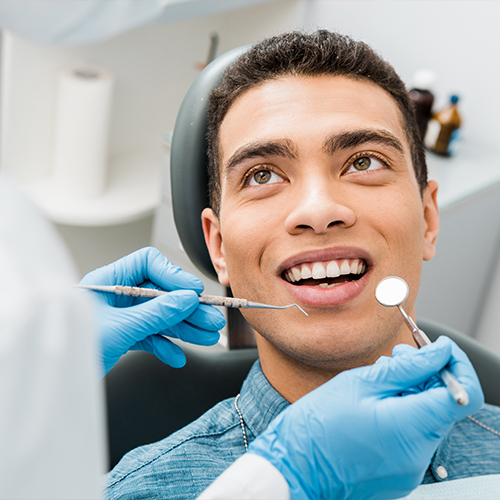 Dental patient receiving oral cancer screening