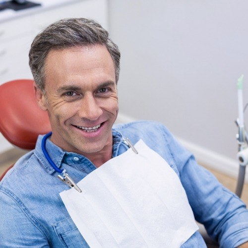 Man smiling after gum disease treatment