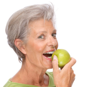 woman preparing to eat apple