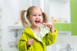 child brushing their teeth