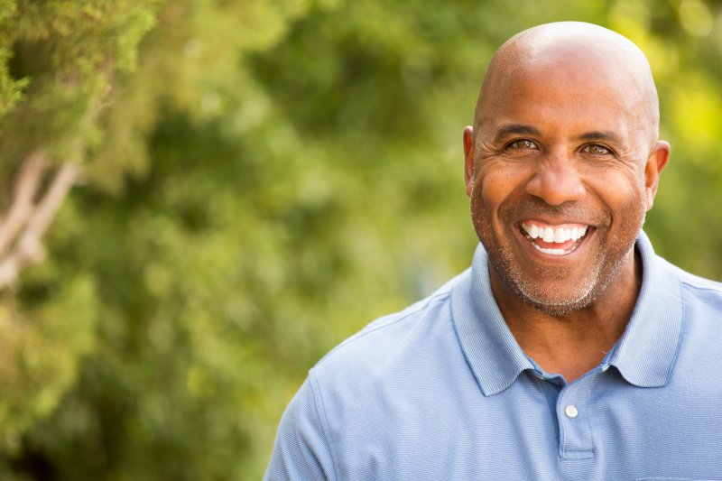 older man smiling bald head