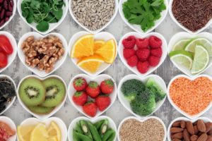 Heart-shaped bowls of healthy snacks for teeth and gums