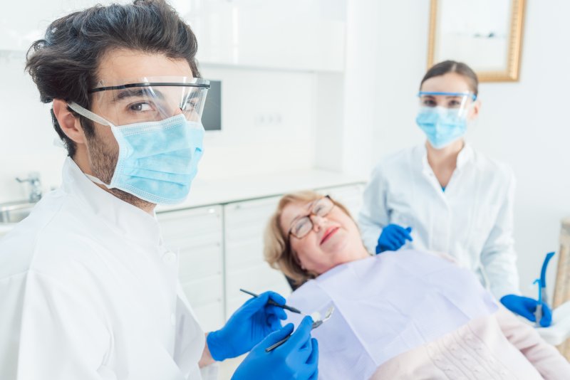 Dentist in Columbia wearing face shield