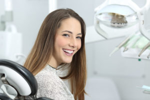 Woman at dentist in Columbia smiling