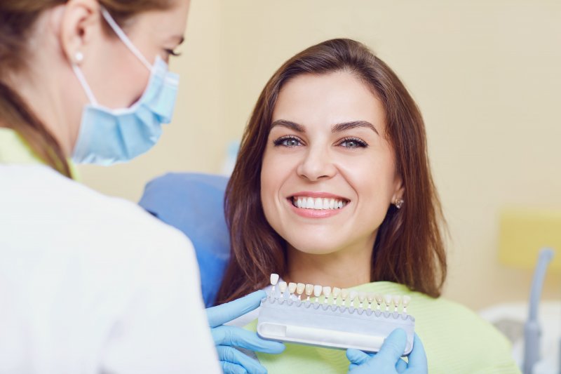 young woman smiling in dentist office
