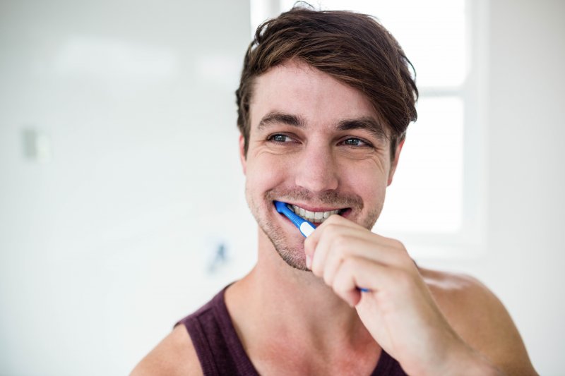 man brushing teeth in Columbia