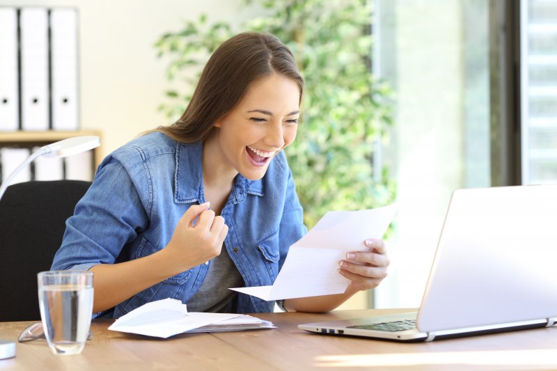 woman smiling after getting tax refund