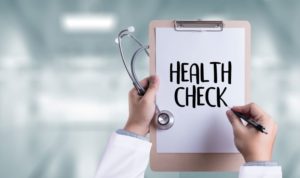 Clipboard with “health check” document on it