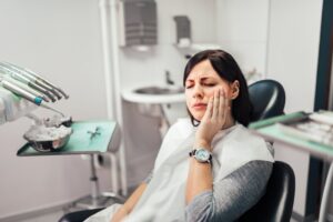 Woman at her dentist with dental pain