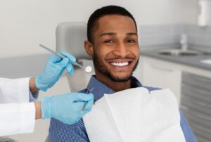 Man smiling after his emergency dental appointment